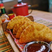 Pina Colada Empanada (Pastel de Pina Colada) · Brazilian empanada made with pineapple and coconut. It’s lightly salted pastry dough is fill...