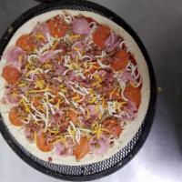Meat Lovers Pizza · Pepperoni, Canadian bacon, sausage, beef, breakfast bacon, blend of mozzarella and cheddar c...