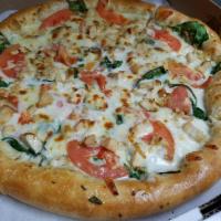 Chicken Alfredo Pizza · Grilled chicken, tomatoes and spinach covered with our traditional Alfredo sauce. 
