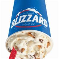 BUTTERFINGER BLIZZARD · Butterfinger® candy pieces blended with creamy vanilla soft serve.