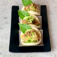 Thai Pulled Pork Buns  · Slow cooked pulled pork in Thai herbs, cucumber, scallion, basil and spicy mayo sauce 