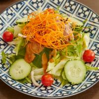 Exotic Green Salad · Mix field greens with tomatoes, shallots, taro sticks, and peanut dressing.
