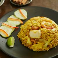 Pineapple Fried Rice  · Chicken, shrimp and squid, with egg, onions, scallions & cashew nuts