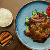 Meakong Aged Pork Chop · Marinated with garlic, Thai pepper, sauteed vegetables, Thai BBQ sauce. Spicy.