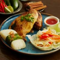 Char-Grilled Chicken · Marinated 1/2 chicken with green papaya salad and coconut sticky rice.