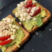 Greek Avocado Toast🇬🇷 · 2 toasted slices of 12 grain bread with fresh mashed avocados topped with cherry tomatoes, G...