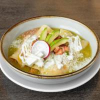 Enchiladas Verdes · Three enchiladas topped with green tomatillo sauce, crema fresca, Cotija, and fresco cheeses...