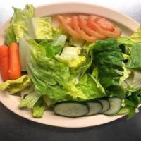 Garden Salad · Romaine lettuce, roma tomatoes, baby carrots and cucumbers.