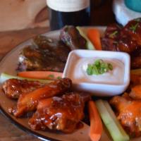 Wings · Buffalo, sweet chili, dry rub, or pineapple habanero. Served with celery, carrots and blue c...