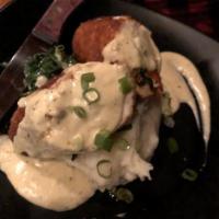 Stuffed Chicken Breast · Stuffed with sun-dried tomatoes, spinach and mozzarella cheese, fried to perfection. Served ...