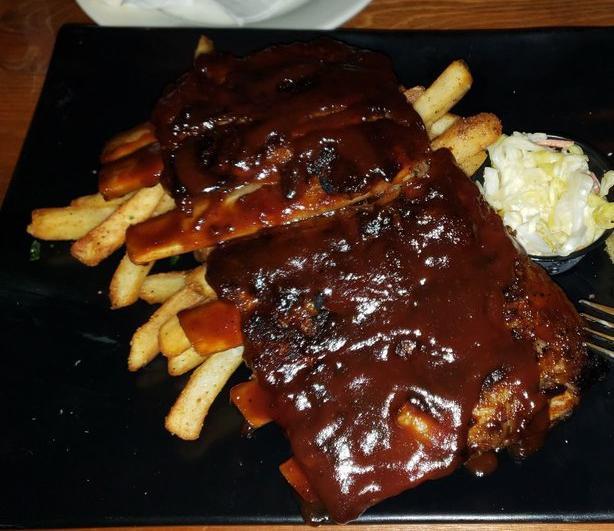 Ribs · 1/2 rack smothered with mango chipotle BBW sauce, coleslaw, cheddar cornbread and cheese fries