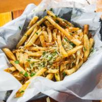 Truffle Fries · French fries tossed in white truffle oil with parsley and fresh shredded parmesan cheese.