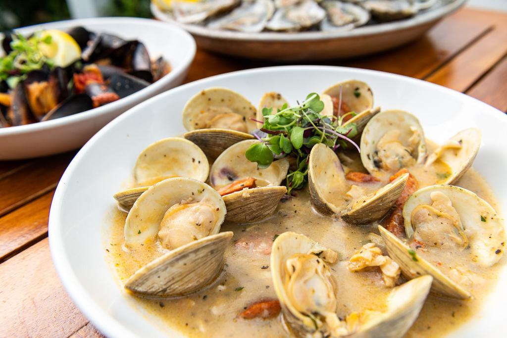 Clam Zuppa · Native littlenecks simmered in a zesty seafood broth with chorizo and marinara sauce.