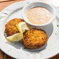 Crab Cakes · 2 pieces. House specialty made with jump lump crabmeat and pan fried. Served with our remoul...