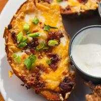Potato Skins · Topped with cheddar jack cheese, bacon and scallions, served with sour cream.