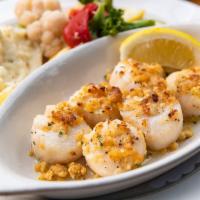 Baked Sea Scallops · Fresh sea scallops baked in a lemon butter and sherry wine sauce dusted with seasoned ritz c...