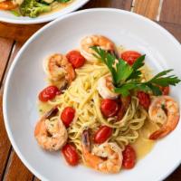 Shrimp Scampi · Sauteed shrimp in a garlic wine sauce tossed with grape tomatoes, served over your choice of...