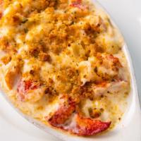Lobster Mac and Cheese · Butter poached lobster pieces tossed in a rich and creamy cheese sauce with pipette pasta th...
