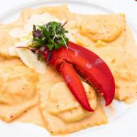 Lobster Ravioli · 6 jumbo pasta pillows filled with ricotta cheese and lobster meat tossed with pink vodka sau...