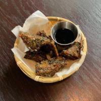 Chive Pancake · 8 pieces. Crispy chive pancake served with chili soy sauce.