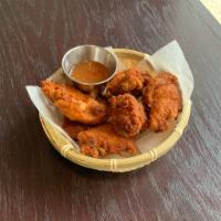 Chicken Wings · 5 pieces. Crispy marinated wings with spicy dipping sauce.