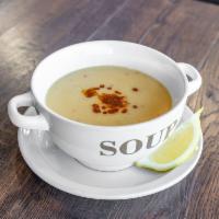 Red Lentil Soup · A savory made with red lentils in a mixture of herbs and sauce.