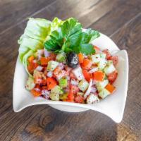 Shepherd Salad · Fresh tomatoes, cucumbers, onions and parsley seasoned with our special blend of oil and vin...