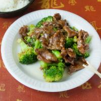 93. Beef with Broccoli · Served with white rice.