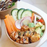 Crispy Teriyaki Tofu Bowl · Jasmine rice, crispy teriyaki tofu, cucumber, carrot, scallion, radish, avocado, sesame.