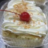 Tres Leches Slices · Served with fruit topping.