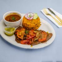Carne asada (Steak and Onions) · Marinated and grilled beef.
