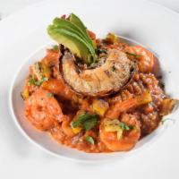 Risotto del Mar · Arborio rice with shrimp, clam, octopus, ripe plantain and azafran. 