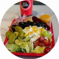 Greek Salad · Lettuce, tomato, feta cheese, olives, pepperoncini peppers, beets, onions, and Greek dressing.