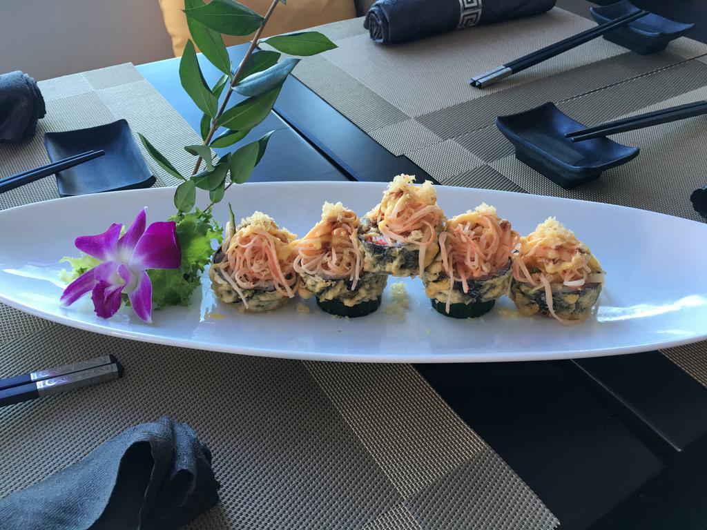 Volcano Roll · Deep-fried white tuna, avocado and tobiko with spicy crunch crab meat on the top