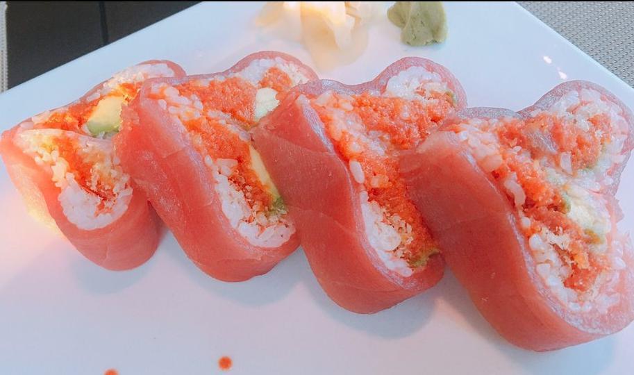 Sweet Heart Roll · Spicy tuna, avocado, tempura flake and tobiko wrapped with fresh tuna.