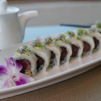 Manhattan Roll · Tuna and avocado topped with yellowtail, jalapeno and onion with jalapeno citrus sauce.