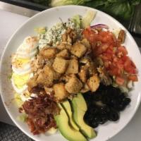 Grilled Chicken Cobb Salad · Mixed greens, crispy chicken, olives, bacon, bleu cheese, tomato, sliced egg and avocado.