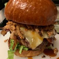 BBQ Burger · 1/3lb cheeseburger served with haystack onions and BBQ sauce on a brioche bun