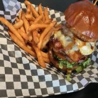 Texas Burger · 1/3lb cheeseburger with bacon, ham and fried egg served with lettuce, tomato, onion ring and...