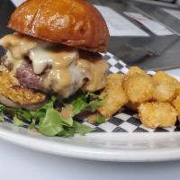 Peanut Butter Bacon Cheeseburger · 1/3lb bacon cheeseburger served with peanut butter sauce, lettuce, tomato and grilled onions...