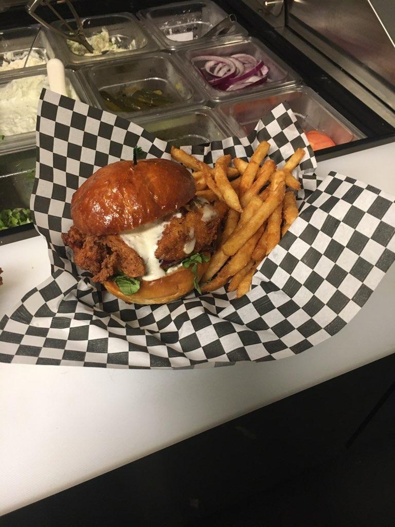 Fried Chicken Burger · 6oz chicken breast with bacon, swiss cheese, lettuce and tomato and grilled onions on a brioche bun.