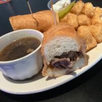 Prim Rib Dip Sandwich · Slice toast beef served on a fresh roll and served with Au jus.
