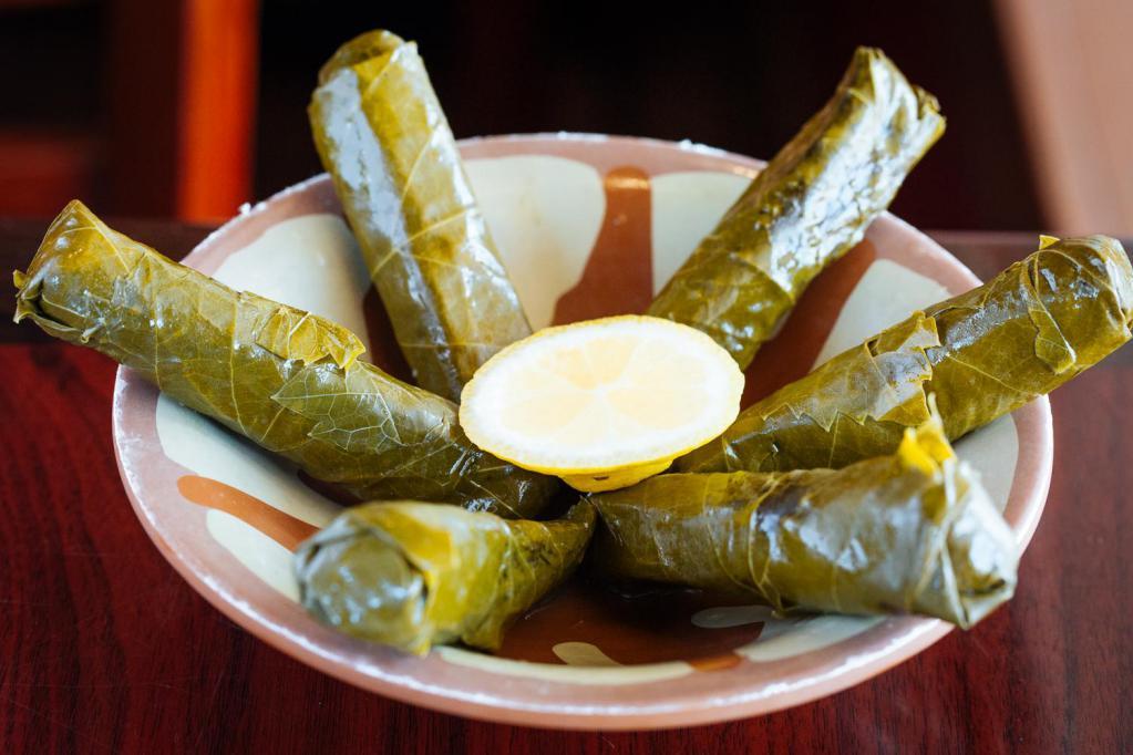 12 pc. Grape Leaves · rolled grape leaves with rice, parsley, onions and spices. 							