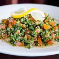 Tabouli Salad · fresh parsley, diced tomatoes and onions, 
cracked wheat and spices with an olive oil 
and...