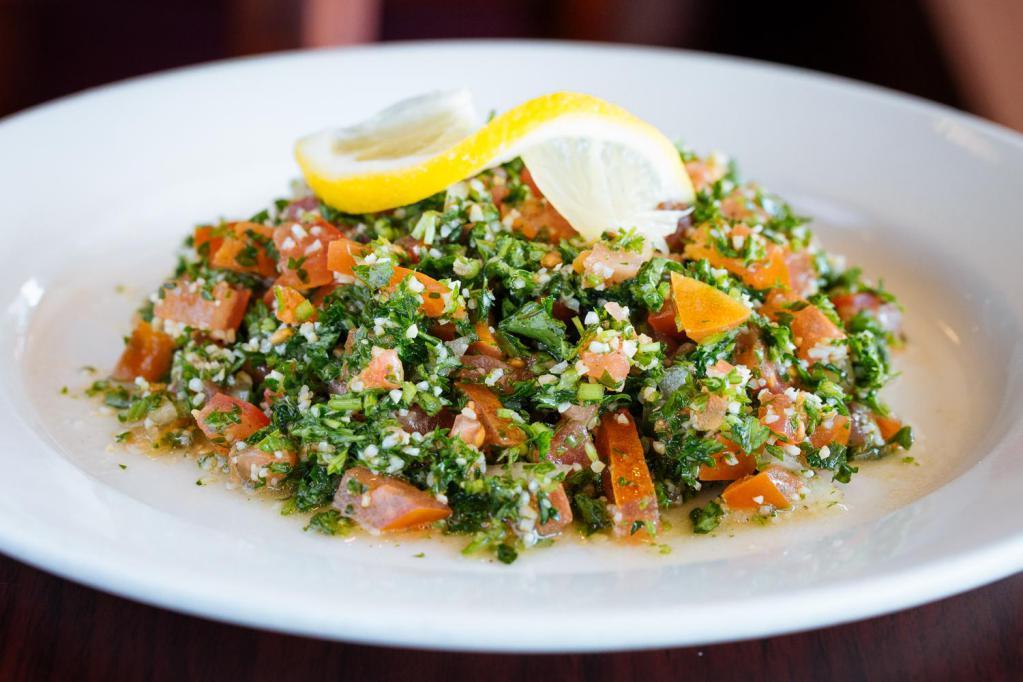 Tabouli Salad · fresh parsley, diced tomatoes and onions, 
cracked wheat and spices with an olive oil 
and lemon juice dressing. 
