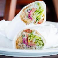 Fal. Sandwich · falafel patties wrapped 
in pita bread with lettuce, tomatoes, 
pickled turnips and tahini...
