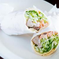 Shish Kab. Sand · lamb, marinated and grilled, wrapped in pita bread with
lettuce, tomatoes, onions and tahin...
