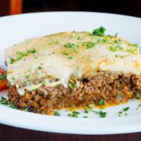 Moussaka · a casserole consisting of sliced eggplant, puréed tomato and ground beef, topped with a rich...
