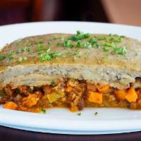 Vegan Moussaka · Breaded eggplant stuffed with artisan locally made seitan, carrots, chickpeas, tomatoes and ...