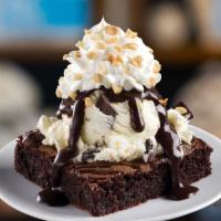 Brownie Sundae · Choose 2 scoops, hot fudge or caramel, dry topping choice, whipped cream on top of warm brow...